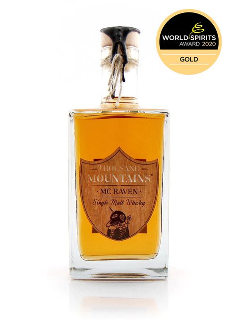 Flasche Thousand Mountains McRaven Single Malt Whisky mit World-Spirits-Award-Siegel in Gold